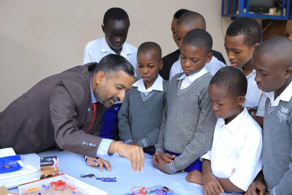 Brahmam mentor demonstrating hands-on electronics innovation with students